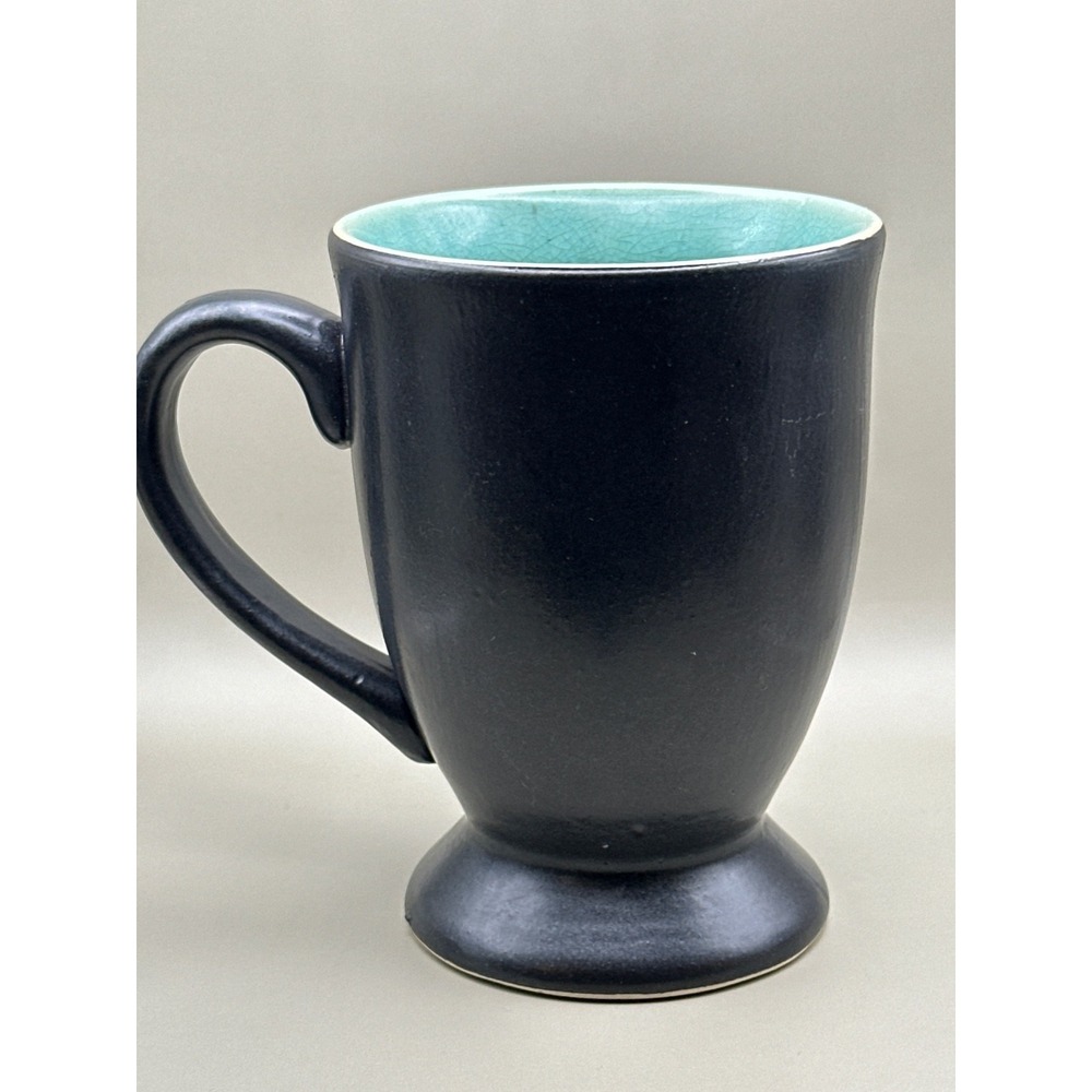 Vintage ceramic mug with aqua crackle glaze interior and Black  exterior.